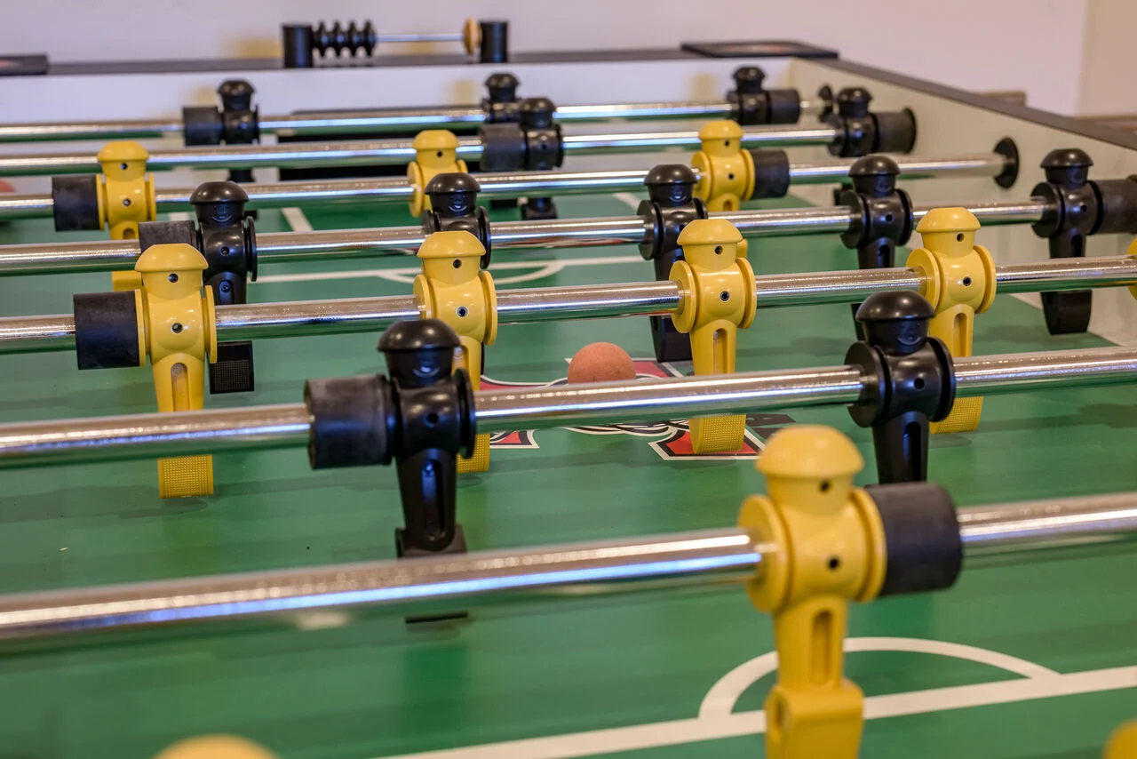 A foosball table in one of our game room rentals