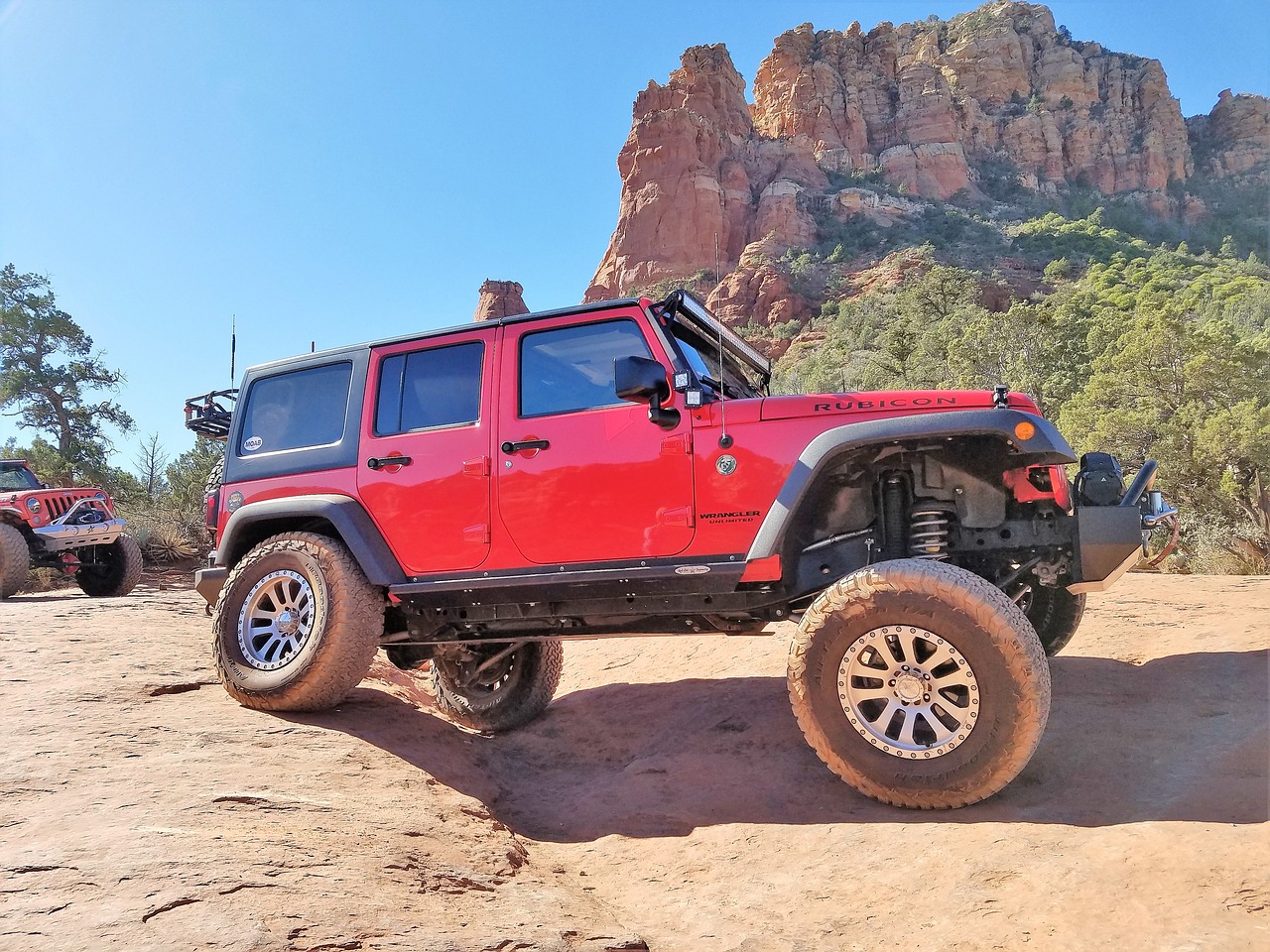 Jeep®s crawling over the red rocks of Sedona